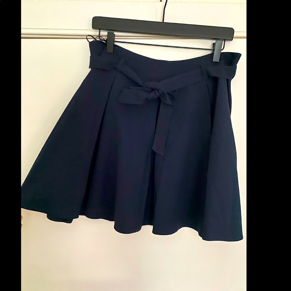 Navy pleated belted mini skirt